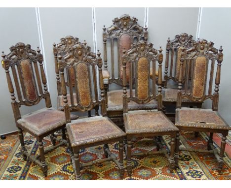 A GOOD SET OF SEVEN (SIX PLUS ONE) VICTORIAN OAK DINING CHAIRS with lion crested top rails, turned finials, carved and reeded