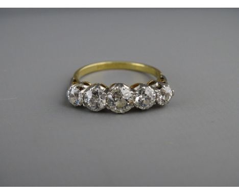 AN EIGHTEEN CARAT GOLD &amp; PLATINUM FIVE STONE DIAMOND RING, visual estimate of each diamond being 0.3, 0.4, 0.6, 0.4, 0.3 