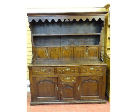 A GEORGE III RARE & FRESH TO THE MARKET SNOWDONIA OAK DRESSER, the canopied rack with decorative apron and wide back boards, 