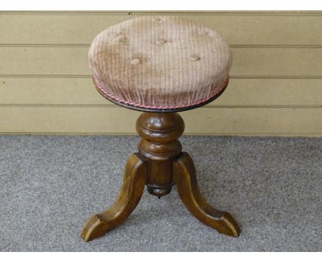 A VICTORIAN MAHOGANY RISE &amp; FALL CIRCULAR PIANO STOOL on a turned column and tripod base with button upholstered seat, 50