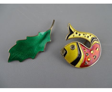TWO NORWAY SILVER &amp; ENAMEL BROOCHES by David Andersen and Karl A Rasmunssen, in leaf and fish form respectively