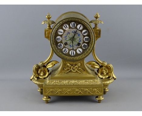 A 19th CENTURY FRENCH GILT METAL MANTEL CLOCK, gilt and enamel porcelain button dial set with Roman numerals, drum cased Japy