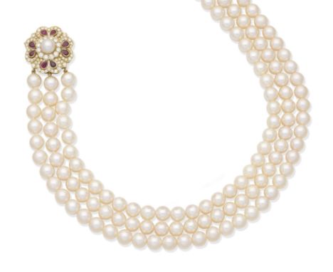 A three-strand cultured pearl collar with a ruby and diamond claspDesigned as three uniform rows of 7.0mm cultured pearls, to