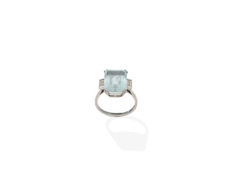 An aquamarine and diamond ringThe step-cut aquamarine between baguette-cut diamond shoulders, ring size approx. N