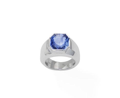 A sapphire ringThe octagonal-shaped sapphire centrally-set within the wide band, ring size approx. R½ (leading edge)