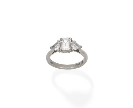 A diamond three-stone ringThe step-cut diamond between trilliant-cut diamond shoulders, mounted in platinum, principal diamon