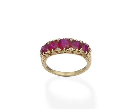 A ruby five-stone ringSet to the front with a graduated row of cushion-shaped rubies, accented by rose-cut diamonds, to a scr