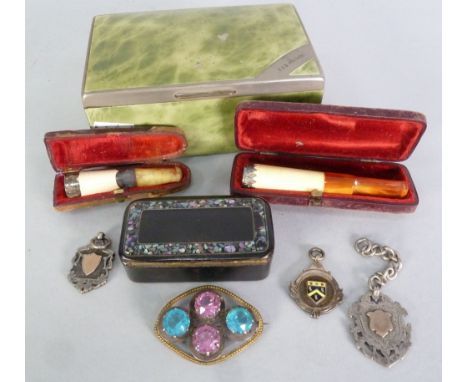 A WHITE METAL AND SIMULATED GREEN TORTOISEHELL COVERED CIGARETTE BOX, containing a cased MEERSCHAUM AND AMBER CHEROOT HOLDER,