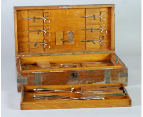 LATE NINETEENTH CENTURY ROYAL NAVY - SURGEONS PART SET OF MEDICAL INSTRUMENTS, HOUSED IN A GOOD QUALITY FITTED OAK AND BRASS 