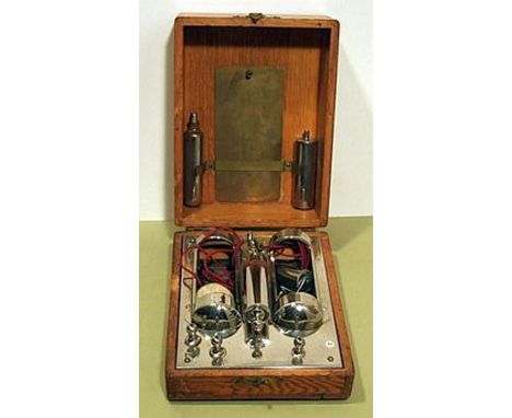 INDUCED CURRENT COIL, , with draw tube nickel plated fittings including two separate dry cell holders (batteries missing), in