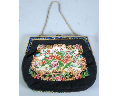 A LADY'S MACHINE WOVEN FLORAL TAPESTRY HANDBAG, with pierced champleve enamel gilt metal frame and suspension chain, with tor
