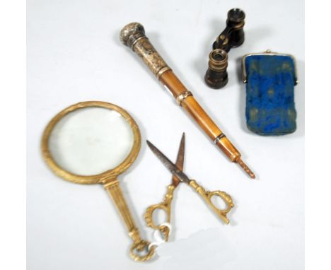 LATE 19TH/EARLY 20TH CENTURY GILT METAL FRAMED magnifying glass with reed and crossed ribbon cast frame, fluted tapering hand