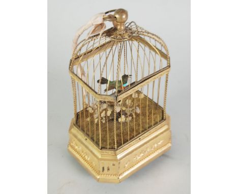 PRE-WAR PROBABLY FRENCH CLOCKWORK SINGING BIRD AUTOMATON, the exotic feathered bird depicted on a perched entwined with fruit