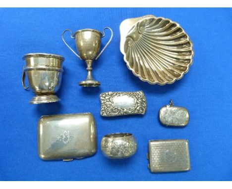 A collection of Silver Items, including a large Continental silver vesta case, two cigarette cases, shell butter dish, an Edw