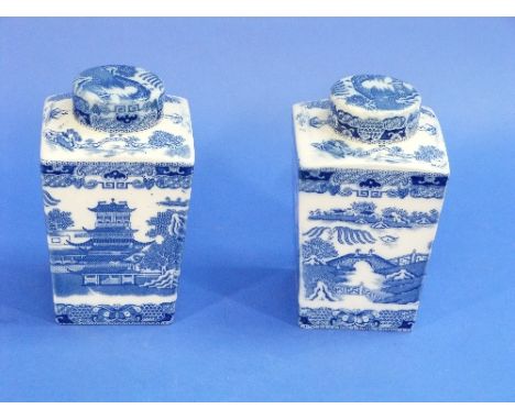 A pair of Mailings Ringtons Tea Caddies and covers, transfer printed in blue and white with Willow pattern, the bases inscrib