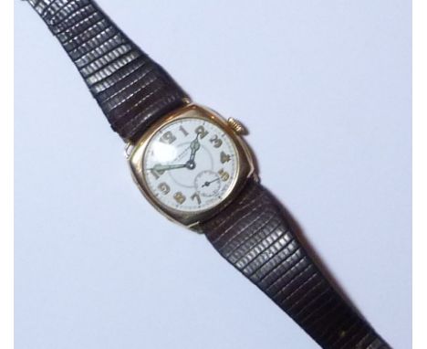 A vintage 9ct gold J. W. Benson gentleman's Wristwatch, with Swiss 16-jewels movement, the cushion shaped case with circular 