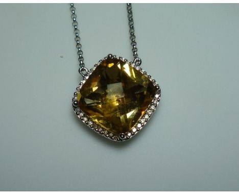 A square facetted citrine Pendant, mounted in 18k white gold, formed into a caged back, and with a surround of small diamonds