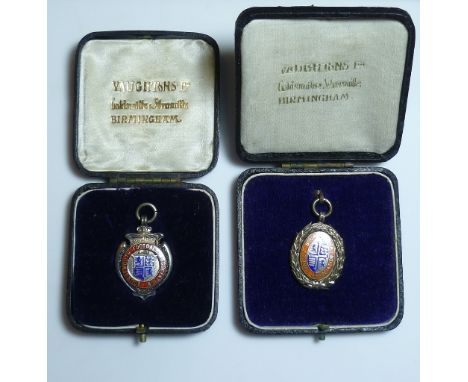 Three Bournemouth Football Association Medals; 1920's and 1930's, silver and enamel, all cased, and a Hampshire F.A. 9ct gold