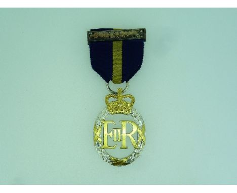 Army Emergency Reserve Decoration, 1952-1967, with ribbon and bar, the reverse inscribed 1964.