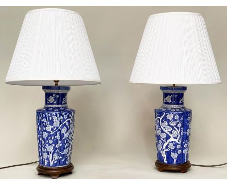 TABLE LAMPS, a pair, Chinese white on blue ceramic of ribbed vase form with birds and blossom, 80cm H. (2) 