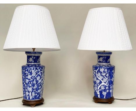 TABLE LAMPS, a pair, Chinese white on blue ceramic of ribbed vase form with birds and blossom, 80cm H. (2) 