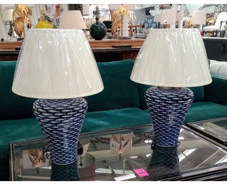 TABLE LAMPS, a pair, 68cm H x 46cm diam., blue and white ceramic with fish design, with shades (2) 