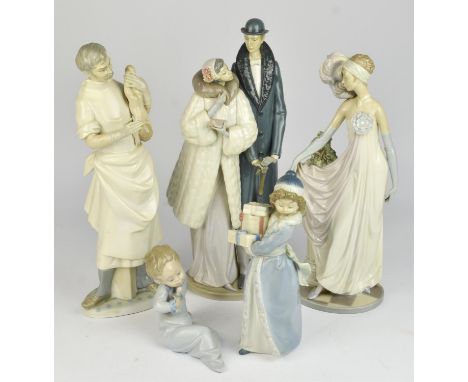 Four Lladro  figures comprising ; Obstetrician, On the Town, Socialite of the 1920's and Baby with Pacifier, also a small Nao