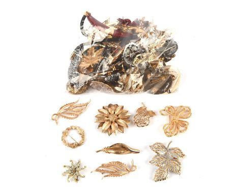 Large group of costume brooches, including examples by Sarah Cov, enamel brooches by Fish, Exquisite, Mali, ceramic channel i