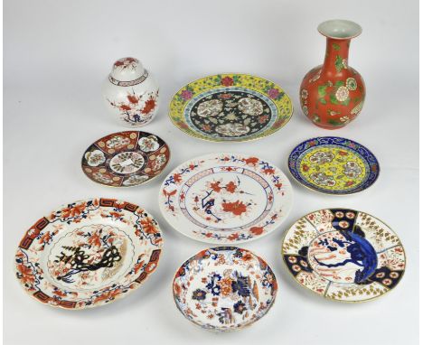 A Mason's ironstone Chinoiserie plate, 19th Century, decorated with buildings and rocks, 26cm diameter, together with two oth