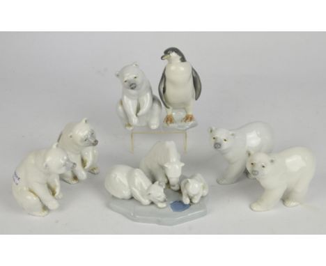 Five Lladro polar bears, a Lladro polar bear group and a Lladro penguin, 14cm high. (7)
