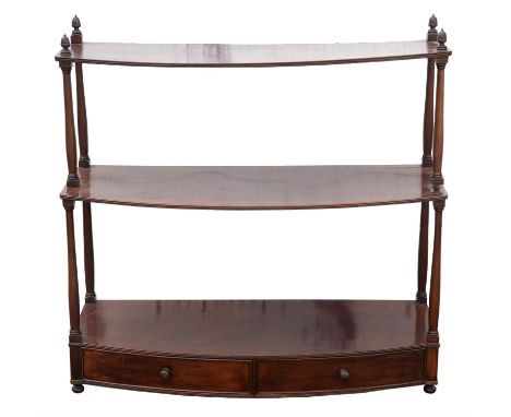 A George III and later bow fronted  mahogany wall shelf, of three tiers with two frieze drawers, 75cm high x 76cm wide x 29cm