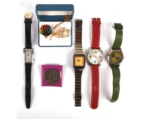 A collection of four wristwatches, including a bi coloured metal bracelet Rado watch, a Beverly Hills polo club watch with bl