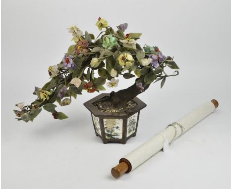 A Chinese hardstone Bonsai tree, displayed in a gilt metal planter of hexagonal form inset with porcelain panels and painted 