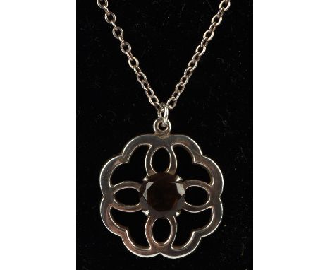 A group of silver items, including a smokey quartz pendant with a curb link chain 45cm long, a citrine brooch in silver surro
