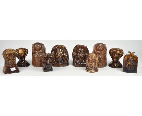 A pair of Victorian stoneware, sash window stops moulded as Spaniels, 14cm high, another pair moulded as lions and six furthe