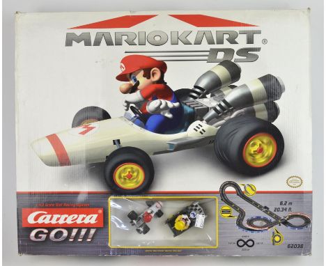 A Mario Kart DS slot car track by Carrera Go, boxed, a Nintendo Mario Kart DS Super Race set, boxed and a Scalextric 400 boxe