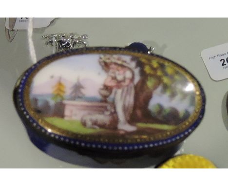 An early 19th Century oval enamelled patch or snuff box, the cover decorated with a young lady in a Mediterranean landscape, 