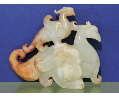 A carved jade pendant, in the form of two phoenix, H. 7cm.