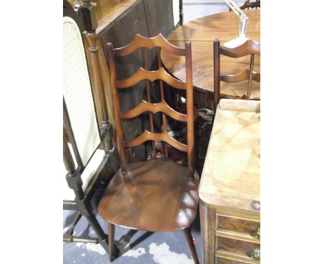 A set of four Ercol elm dining chairs with shaped ladderbacks on slender pole turned legs.