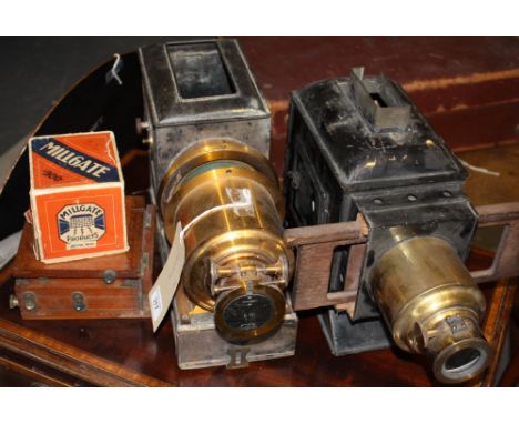 A late 19th Century magic lantern slide protector, a similar smaller projector, a box of slides and an underwood mahogany cam