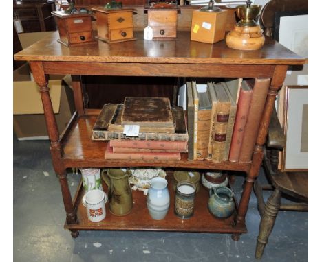 An Edwardian oak three tier buffet on turned ball feet, W. 99cm.