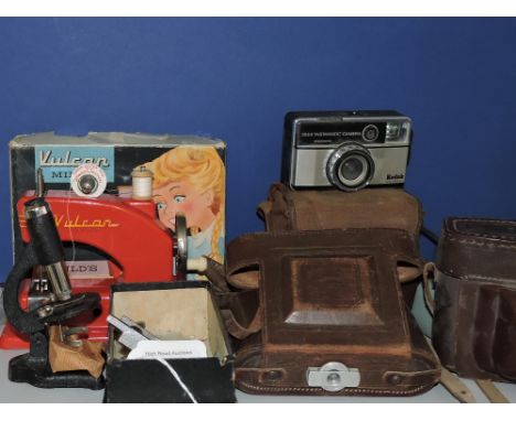 A Zeiss Ikon camera, in brown leather case, together with three others, a Vulcan Minor child's sewing machine and a small mic
