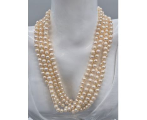 A Selection of fresh water pearl necklaces; 9ct yellow gold clasp and faux pearl Ciro necklace. [77cm drop] 