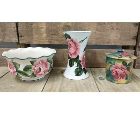 A selection of Wemyss ware Scottish pottery; Wemyss ware jazzy pattern jar with lid, Rose pattern vase along with rose patter