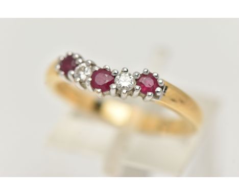 AN 18CT GOLD RUBY AND DIAMOND WISHBONE RING, set with three circular cut rubies, interspaced with two round brilliant cut dia