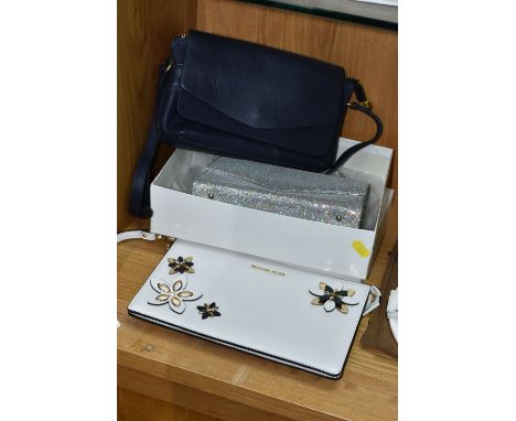 THREE HANDBAGS, comprising a white Michael Kors clutch bag, with three dimensional flower details, and wrist strap, Michael K