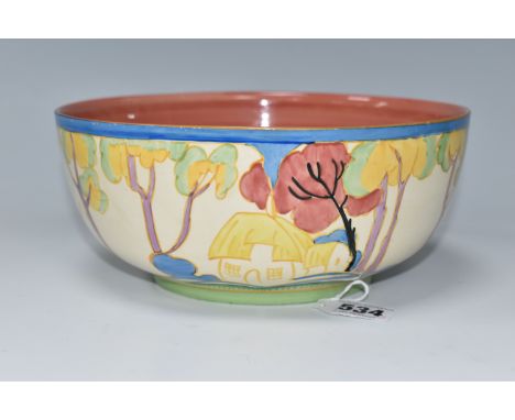 A CLARICE CLIFF FANTASQUE 'TROPIC' PATTERN BOWL, painted with a stylised tropical landscape of houses and trees, the interior