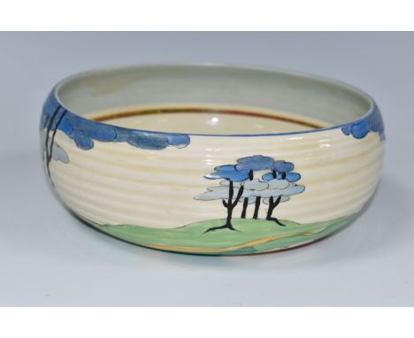 A CLARICE CLIFF 'BLUE FIRS' PATTERN 632 BOWL, painted with stylised blue fir trees in a landscape, with a green banded interi