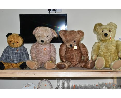 FOUR VINTAGE JOINTED TEDDY BEARS, comprising a golden plush bear with a growler requiring attention wearing a modern coat wit