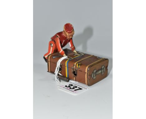 A GESCHA TIN PLATE 'EXPRESS BOY' CLOCKWORK TOY, the boy wearing a red uniform, pushing a trunk, marked 'Gescha' and 'D.R. Pat